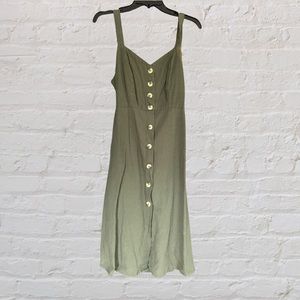 Green button up dress with knot tie in the back